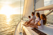 © Spotmatik - Sailing at sunset Hispanic family enjoying carefree vacation