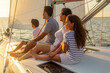 © Spotmatik - Happy Hispanic family relaxing on yacht at sunrise