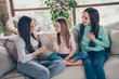 © deagreez - Profile side photo of attractive ladies sitting divan chatting communication listen secret room indoors