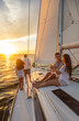 © Spotmatik - Latino family on fun sailing adventure at sunrise
