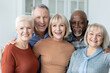 © Prostock-studio - Portrait of multiracial group of senior people friends posing together