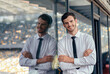 © Friends Stock - Portrait of young man dressed in business suit standing near stadium office