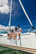 © Spotmatik - Relaxed young Latin American family on private yacht