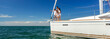 © Spotmatik - Panoramic Latin American family standing together on private yacht
