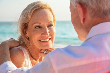 Happy senior couple on tropical island vacation Bahamas