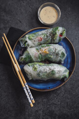 Canvas Print - Rice paper roll with vegetables on plate