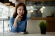 © kamiphotos - Asian women sitting in the office, young Asian business women as business executives, founding and running start-up executives, young female business leaders. Startup business concept.