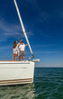 © Spotmatik - Latino family on luxury yacht enjoying sailing vacation