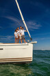 © Spotmatik - Young Hispanic family portrait together on private yacht