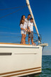 © Spotmatik - Smiling Latino family having fun on luxury yacht