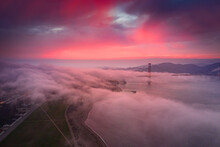Fog over the a bridge at sunset, San Francisco, California, USA