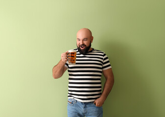 Sticker - Happy bald man with beer on color background