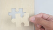 © violetkaipa - Connecting jigsaw puzzle in hand. Business solutions success and strategy concept