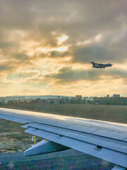 Sticker - Airplane landing as seen from a departing plane.