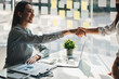 © Natee Meepian - Young asian business people shaking hands in the office. Finishing successful meeting.