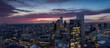 Wide, elavated view over the whole skyline of London, England, from Canary Wharf over the City to Westminster district during dusk