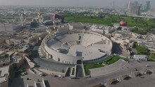 Push in drone shot of the amphitheater in Katara, Qatar.