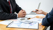 © Freedomz - Business team is checking business document and brainstorming about new startup project while meeting together