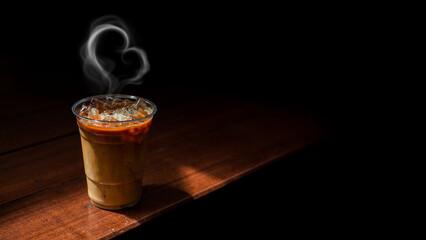 Wall Mural - Ice coffee on a plastic cup with cream being poured into it showing the texture