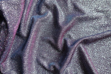Draped shiny purple lurex fabric with pink and blue tinges