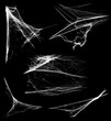 © OleJohny - Overlay the cobweb effect. A collection of spider webs isolated on a black background. Spider web elements as decoration to the design. Halloween Props