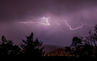 Wall Mural - Beautiful view of a lightning strike in the dark sky