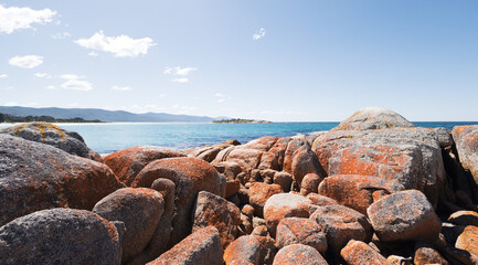 Heap of rocks on the coast against a cloudy sky