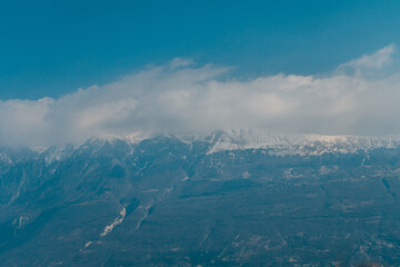 Canvas Print - View to the mountains with cloudy sky on the background