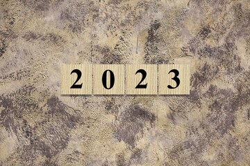 Wall Mural - 2023 on wooden block cube for new year change and start new business strategy concept.