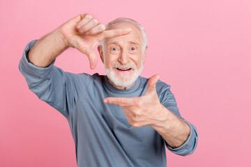 Sticker - Photo of pretty funny guy pensioner dressed grey pullover showing arms photo gesture isolated pink color background