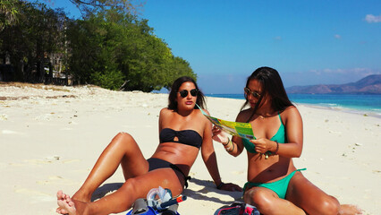 Sticker - Girls after diving relax on a tropical beach Gili Meno, Lombok, Indonesia.