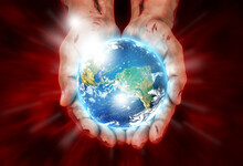 Wounded Hands Of Christ Holding The Earth. Religious Conceptual Theme.