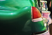 Closuep Shot Of The Headlight Ofa Retro Green Car