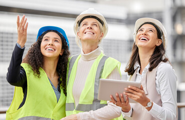 Canvas Print - Envisioning the final product. Cropped shot of three attractive female engineers using a tablet while working on a construction site.