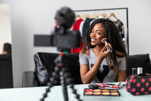 Portrait Of Black Blogger Woman Review Giveaway Make Up Gift To Fan Following Channel While Recording Video Makeup Cosmetic At Home