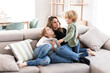 © ADDICTIVE STOCK - Mother with kids on couch