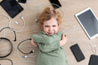 © ADDICTIVE STOCK - Crying boy amidst various gadgets