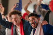 © Halfpoint - French football fans celebrating their team's victory at stadium.