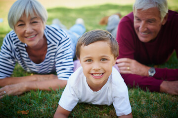 Sticker - They love him to bits. Cropped portrait of a little boy spending time with his grandparents.