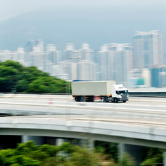 Container truck motion blur on highway overpass