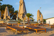 © stopabox - beach scene in Side Turkey with empty umbrellas and sun loungers. Vacation at the sea. Summer holidays.