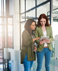 Poster - Taking a look at some data online. Shot of businesswomen using a digital tablet in an office.