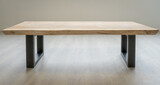 Fototapeta  - Stół kawowy z egzotycznego drewna suar. Blat przytwierdzony jest do masywnych, metalowych nóg. Stół jest w stylu industrialnym.