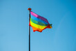 © Khrystyna Vartanova - Rainbow flag waving against blue sky