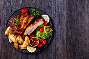 Poster - juicy roast pork ribs with veggies, top view