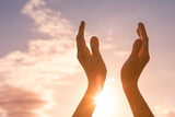 Fototapeta Mapy - worshiping hands up to the sun light sky. Positive energy, prayer and gratitude concept.	