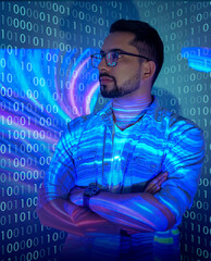 software developer / hacker working on a virtual computer, projected code numbers and characters ref