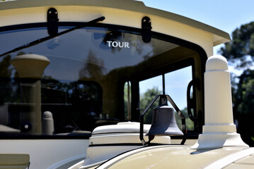 Beautiful view of an exterior of a tourist train for a touristic tour with a blue sky