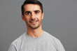 © SHOTPRIME STUDIO - Cheerful man fun gray t-shirt hand gesture Gray background