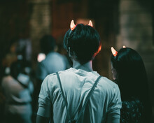 Couple Wearing Devil Horn Headbands During The Halloween Event At Universal Studios, Singapore
